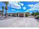 Charming single-story home boasts a well-manicured yard and attached two-car garage at 6041 E Colby St, Mesa, AZ 85205