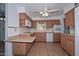 Functional kitchen boasts tile floors, white appliances, and ample cabinet space for storage at 6041 E Colby St, Mesa, AZ 85205
