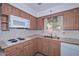 This kitchen features plenty of counter space and a window over the sink at 6041 E Colby St, Mesa, AZ 85205