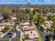 Aerial view of a residential neighborhood with lush landscaping and mountain views at 617 W Gibraltar Ln, Phoenix, AZ 85023