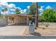 Inviting home exterior with a covered carport, mailbox, and desert landscaping at 617 W Gibraltar Ln, Phoenix, AZ 85023