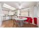 Cozy kitchen with table and white cabinets for a bright and welcoming atmosphere at 617 W Gibraltar Ln, Phoenix, AZ 85023