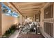 Covered patio featuring comfortable seating and an outdoor dining area at 617 W Gibraltar Ln, Phoenix, AZ 85023