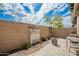 Secluded backyard featuring a decorative stone water feature and an outdoor seating area at 7343 E Casitas Del Rio Dr, Scottsdale, AZ 85255
