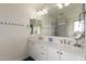 Bright bathroom with double sinks, quartz countertops, and a large mirror, designed for style and functionality at 7343 E Casitas Del Rio Dr, Scottsdale, AZ 85255