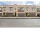 Contemporary townhome exterior showcasing neutral tones, private garages, and landscaped front yards at 7343 E Casitas Del Rio Dr, Scottsdale, AZ 85255