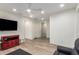 Inviting living room with sleek hardwood floors, recessed lighting, and a stylish red cabinet, ideal for entertaining at 7343 E Casitas Del Rio Dr, Scottsdale, AZ 85255