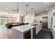 Bright open-concept space with island, kitchen, living and dining areas, perfect for entertaining at 7343 E Casitas Del Rio Dr, Scottsdale, AZ 85255