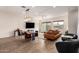 Open-concept living space featuring tile floors, dining area and a comfortable sectional sofa at 7343 E Casitas Del Rio Dr, Scottsdale, AZ 85255