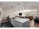 Open-concept living space with island, connecting the kitchen and living area at 7343 E Casitas Del Rio Dr, Scottsdale, AZ 85255