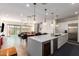 Open-concept kitchen and living space with breakfast bar and stainless steel appliances at 7343 E Casitas Del Rio Dr, Scottsdale, AZ 85255