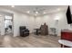 Bright office with a ceiling fan, a gray leather chair, and a workspace with natural light, perfect for productivity at 7343 E Casitas Del Rio Dr, Scottsdale, AZ 85255