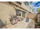 Private outdoor patio with a built-in grill, dining set, and hardscaped design at 7343 E Casitas Del Rio Dr, Scottsdale, AZ 85255