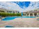 Community pool area with lounge chairs and lush landscaping, perfect for relaxation and recreation at 7343 E Casitas Del Rio Dr, Scottsdale, AZ 85255
