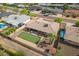 Aerial view of the property showcasing the backyard putting green, patio and landscaping at 8222 E Sheridan St, Scottsdale, AZ 85257