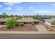 Aerial view of the home featuring a desert landscaped front yard and a covered carport at 8222 E Sheridan St, Scottsdale, AZ 85257