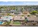 Aerial view of a residential area featuring a home with putting green, pool, and desert landscape at 8222 E Sheridan St, Scottsdale, AZ 85257