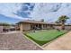 Backyard showcasing a putting green, outdoor kitchen, and patio area, great for entertaining at 8222 E Sheridan St, Scottsdale, AZ 85257