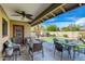 Charming backyard featuring a putting green, patio seating, and manicured landscaping at 8222 E Sheridan St, Scottsdale, AZ 85257