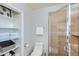 Bathroom with glass shower and shelving for linens at 8222 E Sheridan St, Scottsdale, AZ 85257