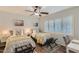 Bedroom with ceiling fan, shutters, and twin beds at 8222 E Sheridan St, Scottsdale, AZ 85257
