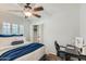 Bedroom with ceiling fan, shutters, and closet at 8222 E Sheridan St, Scottsdale, AZ 85257