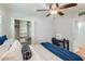 Bedroom with ceiling fan, shutters, and closet at 8222 E Sheridan St, Scottsdale, AZ 85257