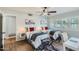 Bedroom features twin beds, ceiling fan, and shutters at 8222 E Sheridan St, Scottsdale, AZ 85257