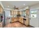 Charming kitchen featuring wood cabinets, stainless steel appliances, and tile countertops at 8222 E Sheridan St, Scottsdale, AZ 85257