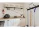 Practical laundry room with ample storage and counter space at 8222 E Sheridan St, Scottsdale, AZ 85257