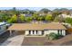 Overhead view of home with desert landscape, covered parking, and clean lines, set against a mountainous backdrop at 845 E Village Circle S Dr, Phoenix, AZ 85022