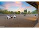 Spacious gravel backyard with a cozy fire pit, modern seating and desert landscaping, perfect for relaxed outdoor evenings at 845 E Village Circle S Dr, Phoenix, AZ 85022