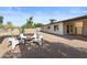 A spacious backyard area featuring desert landscaping, modern seating, and a well-maintained home exterior at 845 E Village Circle S Dr, Phoenix, AZ 85022