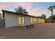 This home has an inviting gravel backyard space with a patio area for outdoor seating and relaxation at 845 E Village Circle S Dr, Phoenix, AZ 85022