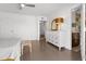 Bright bedroom featuring light wood floors, a modern white dresser, and neutral decor at 845 E Village Circle S Dr, Phoenix, AZ 85022