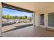 A view from a covered patio to a spacious backyard, enhanced with desert landscaping and outdoor seating at 845 E Village Circle S Dr, Phoenix, AZ 85022
