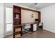 Sleek home office featuring custom built-ins, modern chairs, ample storage, and a bright window at 845 E Village Circle S Dr, Phoenix, AZ 85022