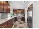 Stylish kitchen with stainless steel appliances, dark cabinetry, and modern finishes at 845 E Village Circle S Dr, Phoenix, AZ 85022