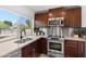 Bright and functional kitchen with modern appliances and a large window overlooking the yard at 845 E Village Circle S Dr, Phoenix, AZ 85022