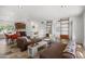 Open-concept living area with sleek design, stylish seating, and tiled floors, perfect for entertaining at 845 E Village Circle S Dr, Phoenix, AZ 85022