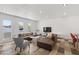 Spacious living area with large windows, modern furniture, and stylish tile flooring at 845 E Village Circle S Dr, Phoenix, AZ 85022