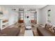Well-lit living room showcasing tiled flooring, neutral tones, and decorative shelving at 845 E Village Circle S Dr, Phoenix, AZ 85022
