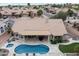 Beautiful backyard with a pool, spa, patio, and desert landscaping at 8542 W Rosemonte Dr, Peoria, AZ 85382