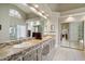 Main bathroom featuring double sinks, a large mirror and a walk in closet at 8542 W Rosemonte Dr, Peoria, AZ 85382