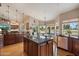 Spacious kitchen with a large island and views to the breakfast nook and living spaces at 8542 W Rosemonte Dr, Peoria, AZ 85382