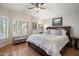Charming main bedroom with plantation shutters, hardwood floors and neutral decor at 8542 W Rosemonte Dr, Peoria, AZ 85382