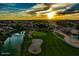Breathtaking sunset over a golf course community with mountains in the distance at 8542 W Rosemonte Dr, Peoria, AZ 85382