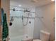 Bathroom with white-tiled walk-in shower, modern fixtures, and decorative glass at 921 S Val Vista Dr # 28, Mesa, AZ 85204