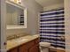 Bathroom featuring granite countertops, a single sink, and a shower with a striped curtain at 921 S Val Vista Dr # 28, Mesa, AZ 85204