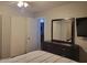 Bedroom featuring carpet floors, neutral walls, and a well-lit open closet at 921 S Val Vista Dr # 28, Mesa, AZ 85204